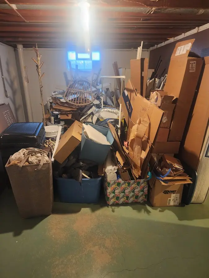 Roll-off dumpster container at job site for 15 Yard Dumpster Rental in Romulus