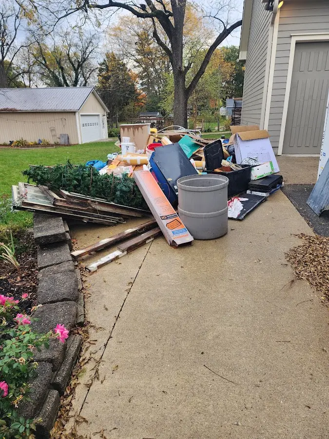 Dumpster being loaded with debris for Demolition Dumpster Rental in Romulus